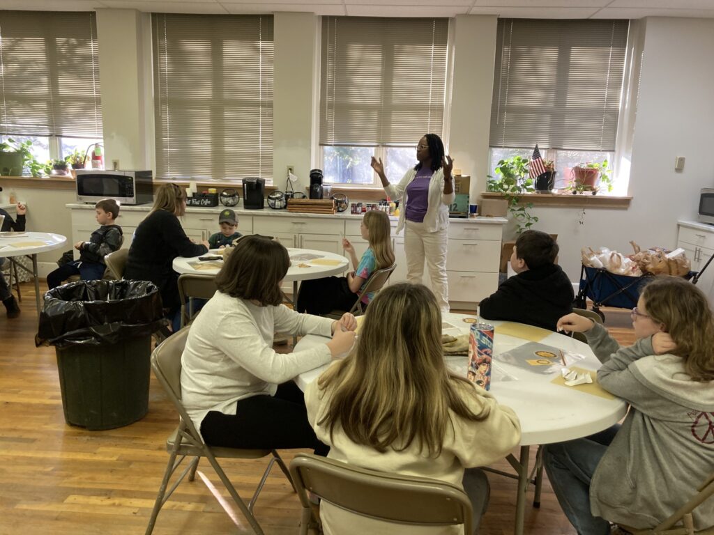 4-H participants tasting honey